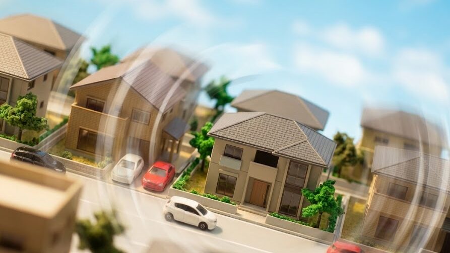 S波による横揺れが建物全体に大きな力を与える様子を、住宅街で表現したイメージ