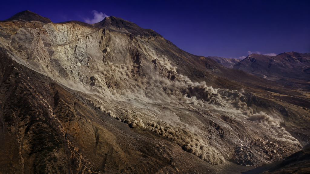 山の斜面から岩石と土砂が横方向に流れ下る山体崩壊のエネルギーを
表した俯瞰イメージ